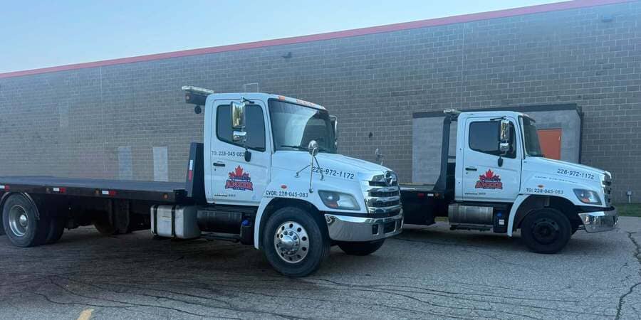 Professional tow truck driver helping customer
